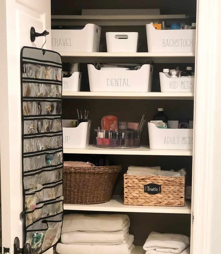 Bathroom closet with baskets and bins