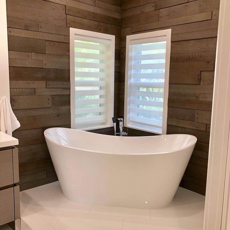 Modern bathroom with freestanding tub and wooden walls