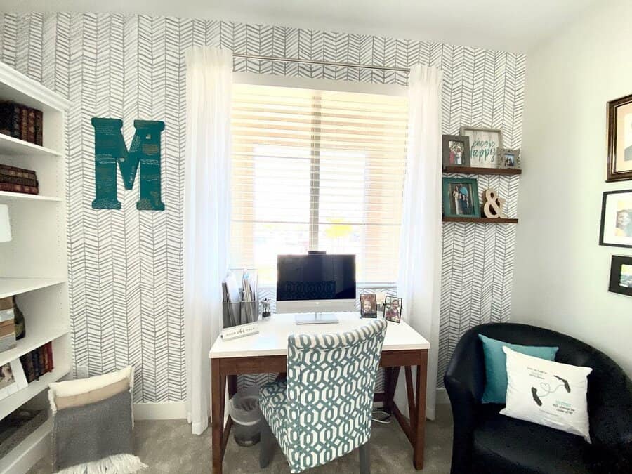 Cozy corner office with bookshelf and patterned accents