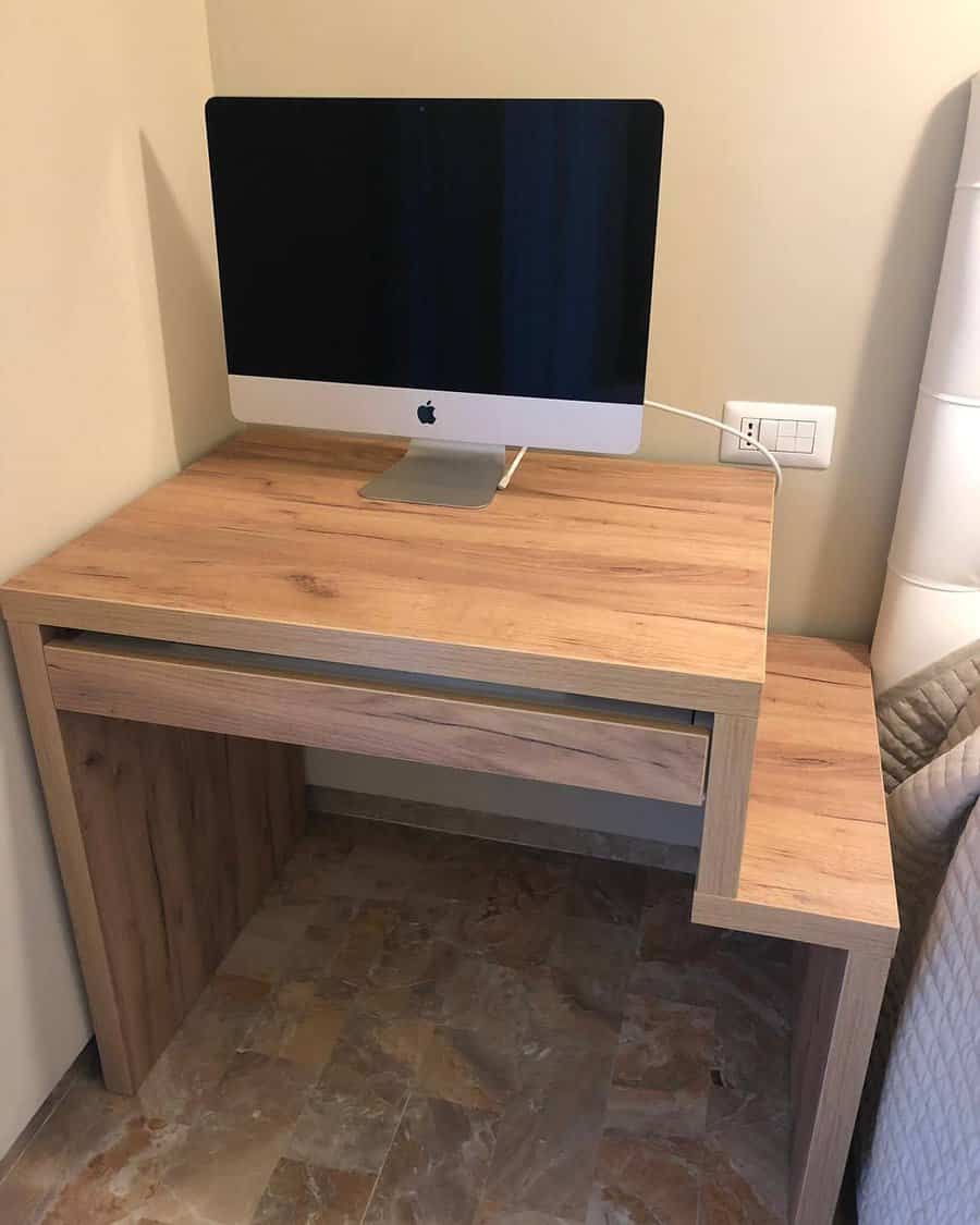 Simple home office with wooden desk and iMac