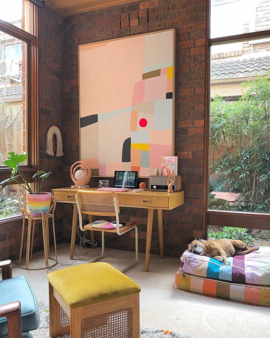 Artistic home office with brick walls and sleeping dog