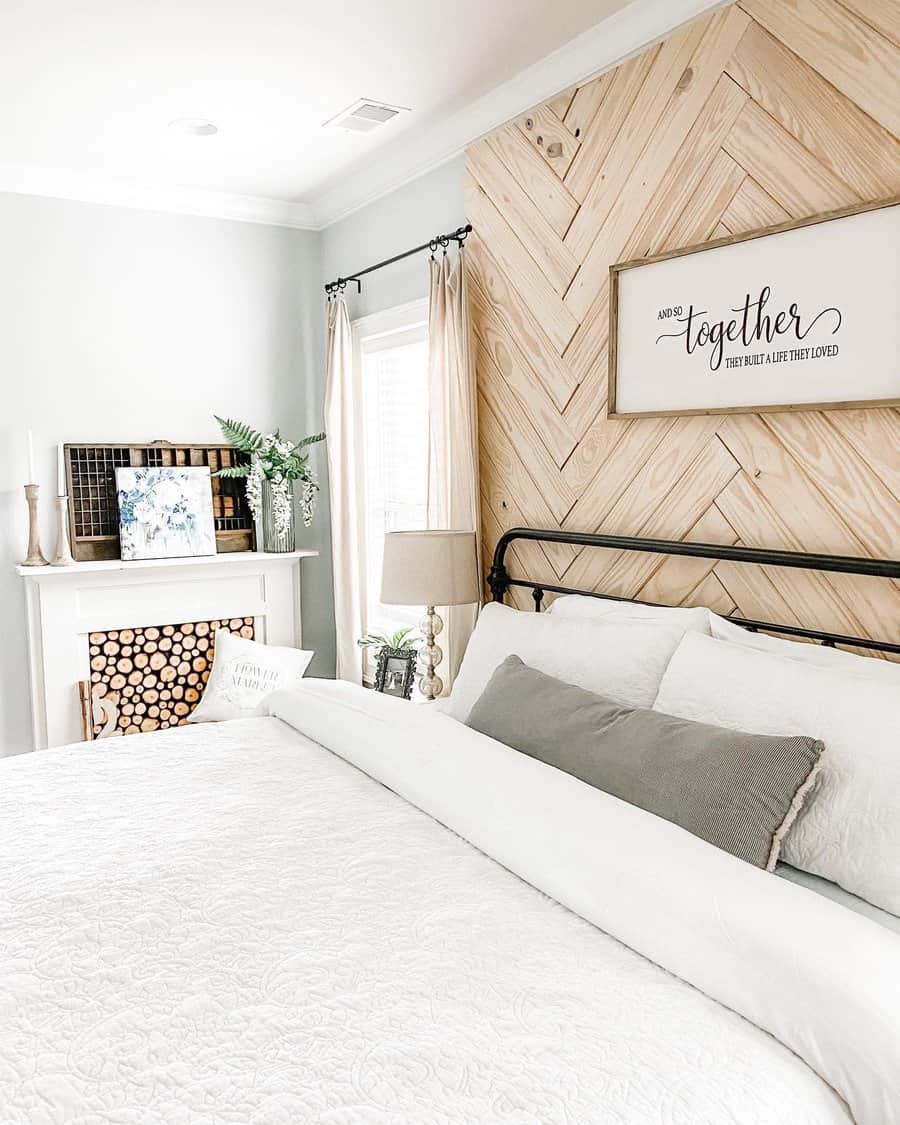 Bright bedroom with herringbone wood accent wall and cozy decor