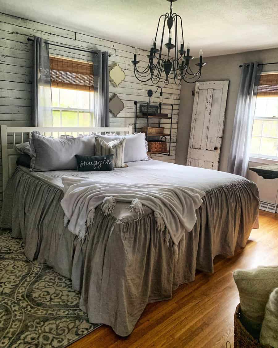 Shabby chic bedroom with distressed pallet wall and vintage decor