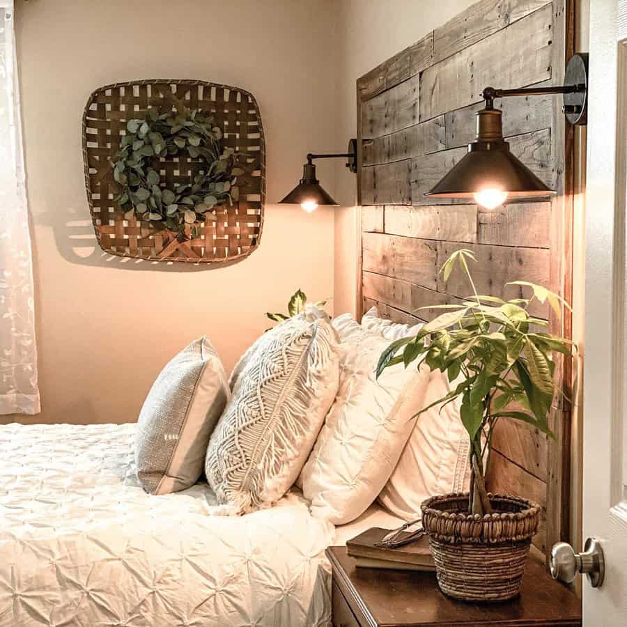 Cozy bedroom with wooden pallet headboard and wall sconces