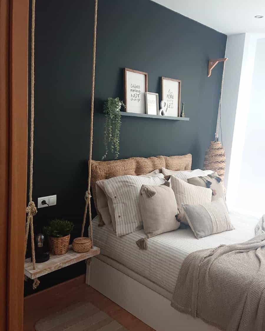 Cozy bedroom with a dark wall and hanging shelf