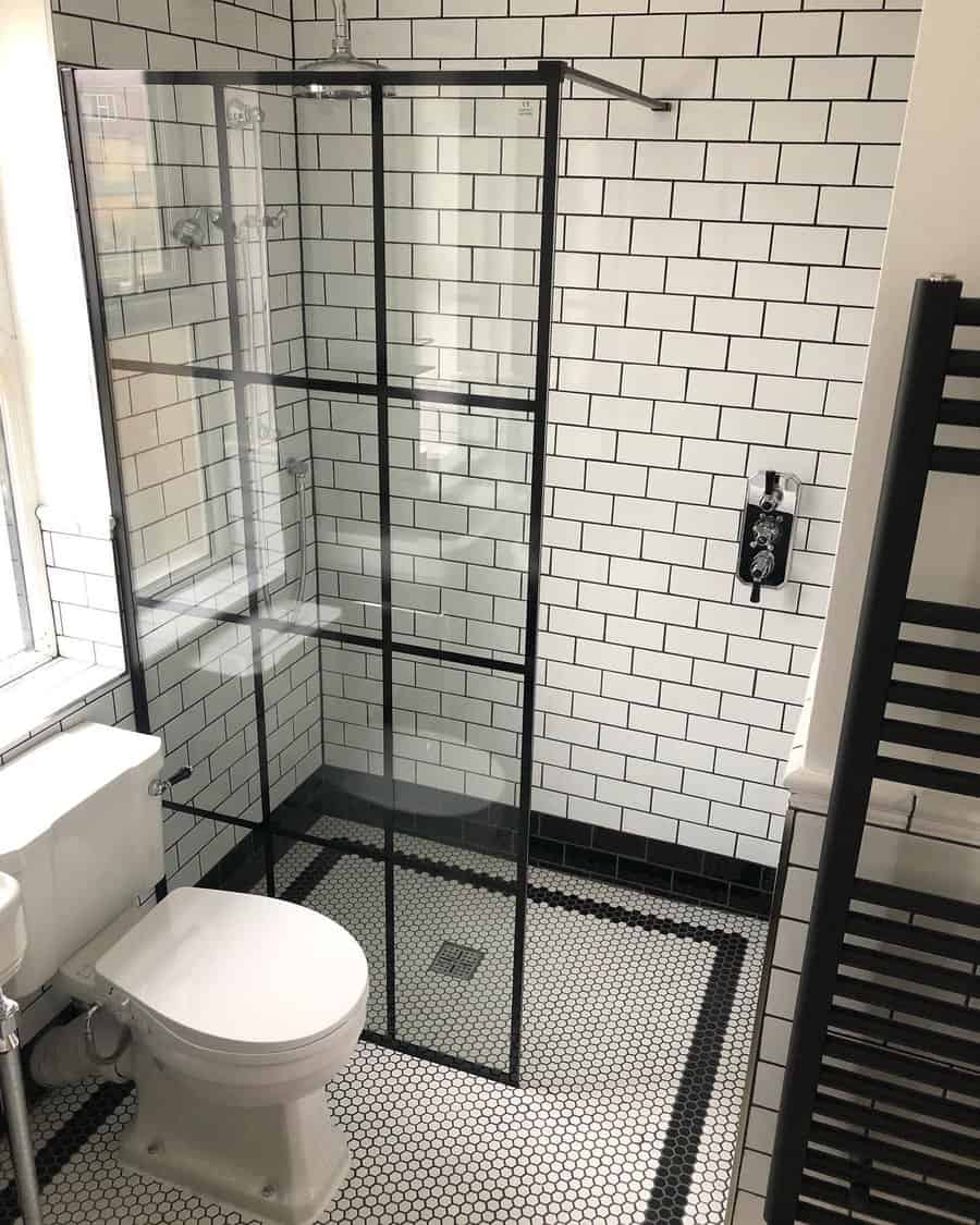 walk-in shower with black-framed splash screen