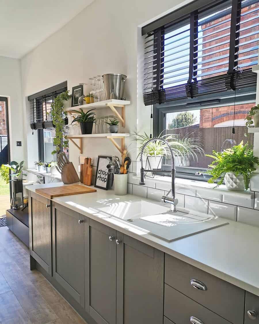 White kitchen with black window blinds