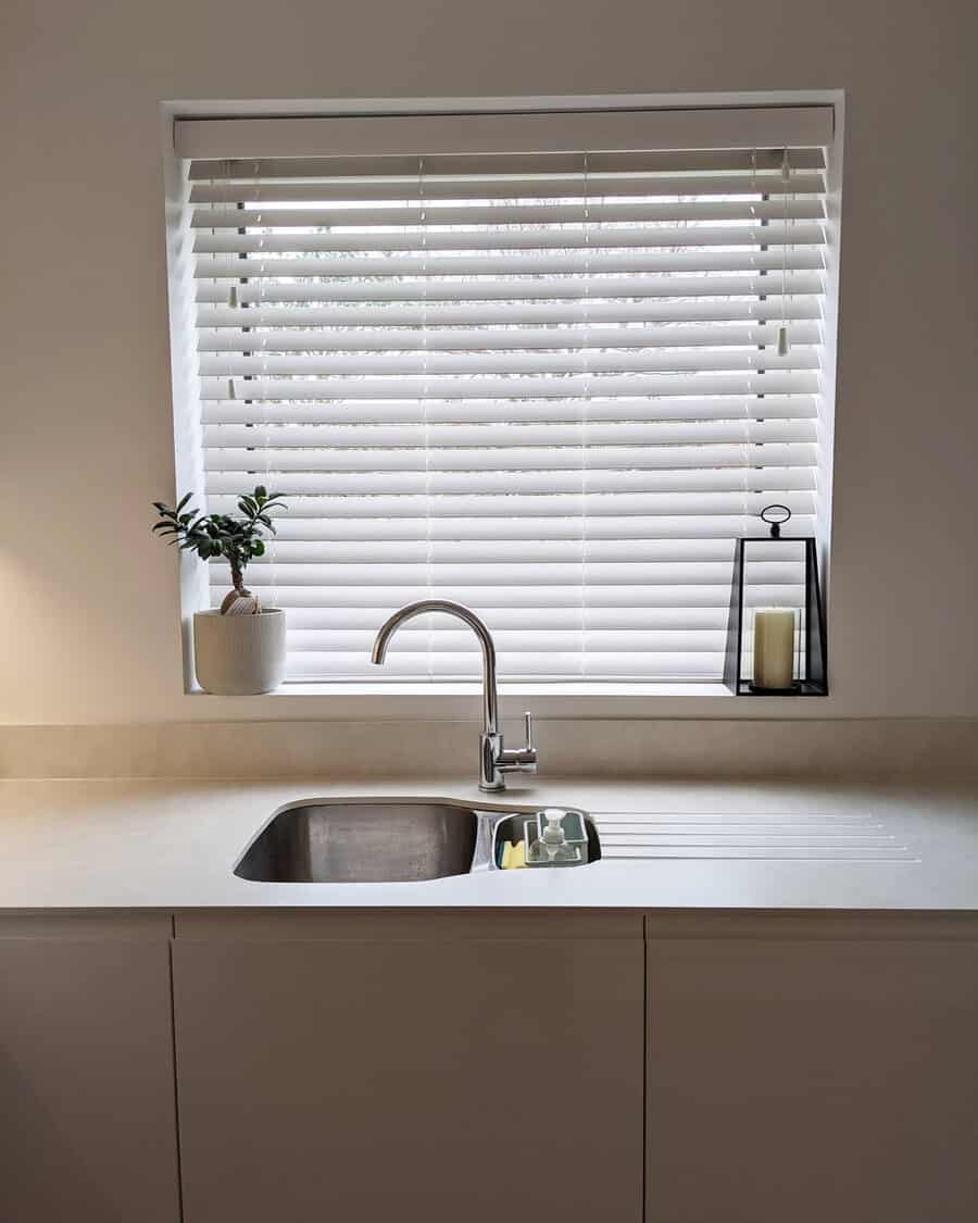 White kitchen with white window blinds