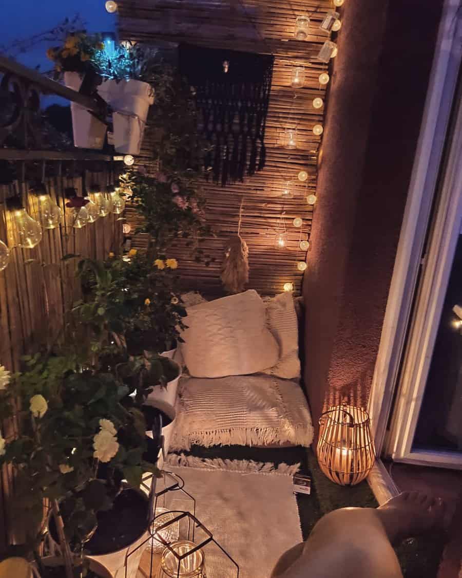 Boho-style balcony with soft cushions, warm string lights, lush greenery, and a relaxing ambiance for a peaceful night retreat