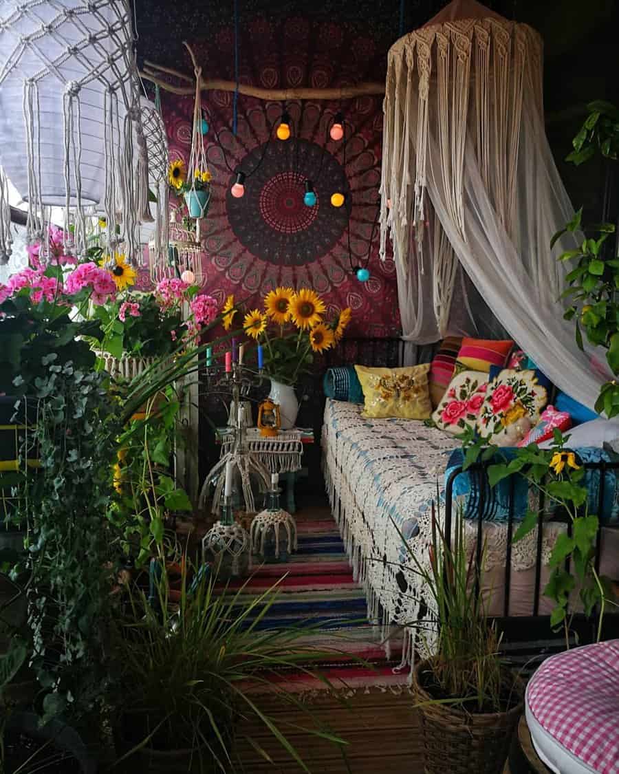 A cozy bohemian balcony with vibrant flowers, a patterned tapestry, hanging lights, and a cushioned daybed draped with a mosquito net