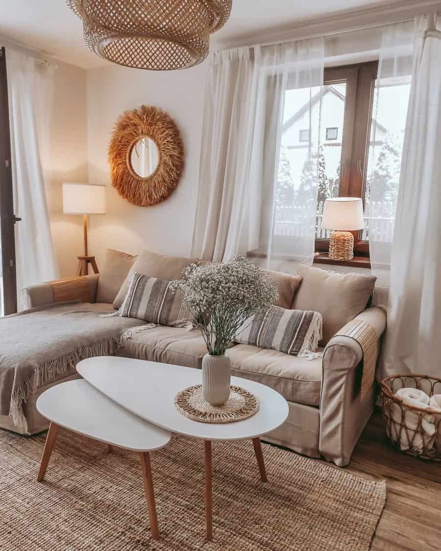 Boho living room with a beige sofa, white coffee table, and decorative mirror