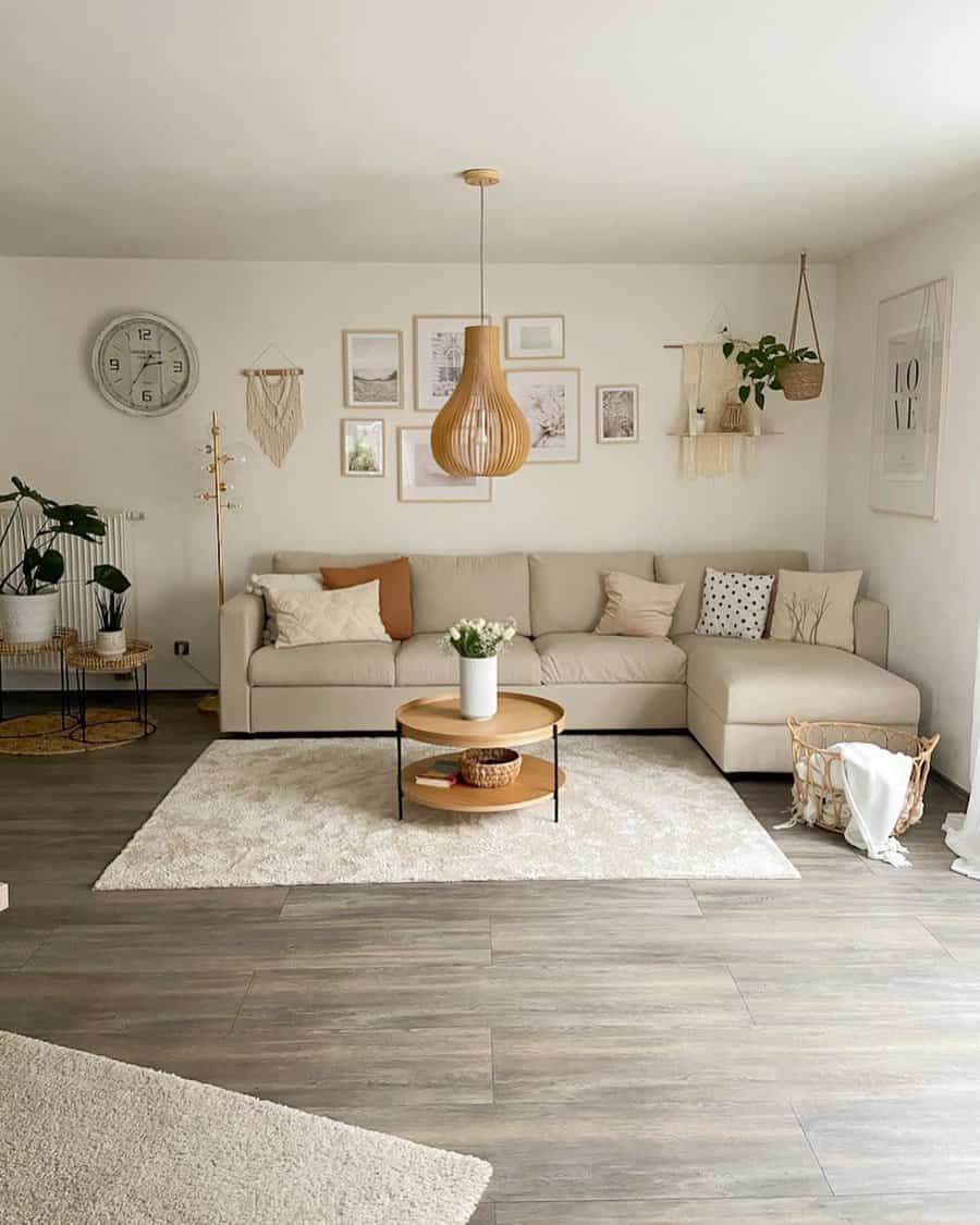 Modern, boho living room with a beige corner sofa, wooden decor, and potted plants