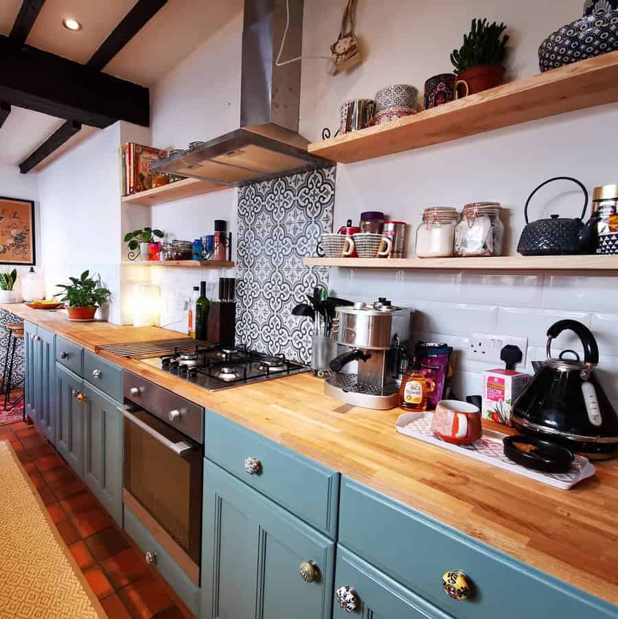 small galley kitchen with wall shelves