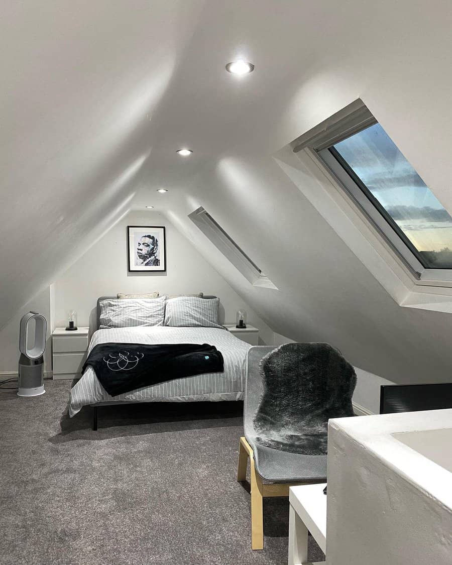 Minimalist attic bedroom with sleek white walls, skylights, and cozy gray tones. A modern aesthetic with soft textures and ambient lighting.