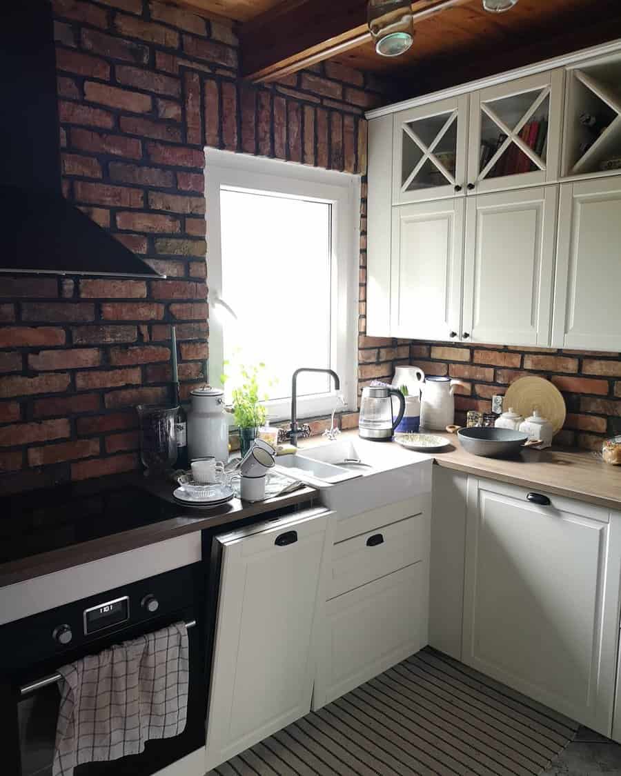 Rustic kitchen with exposed brick wall