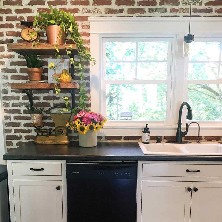 Rustic kitchen with exposed brick wall