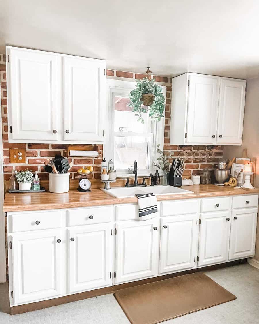 Rustic kitchen with exposed brick wall