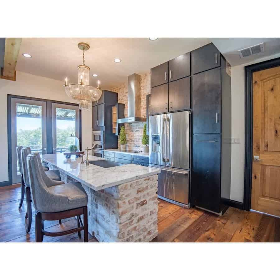 Rustic kitchen with exposed brick wall