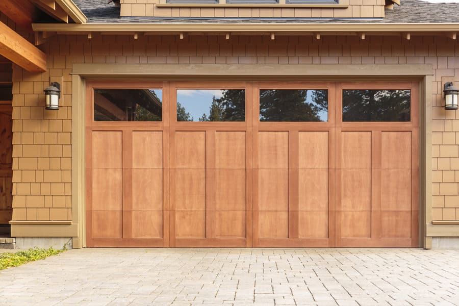 Wooden garage door with glass windows on top