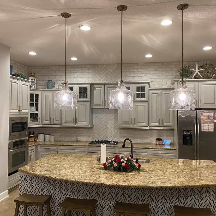 Elegant kitchen with herringbone backsplash