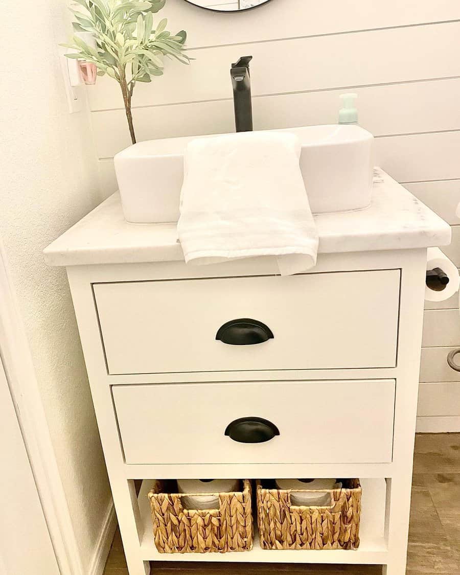 Half bathroom with black fixtures