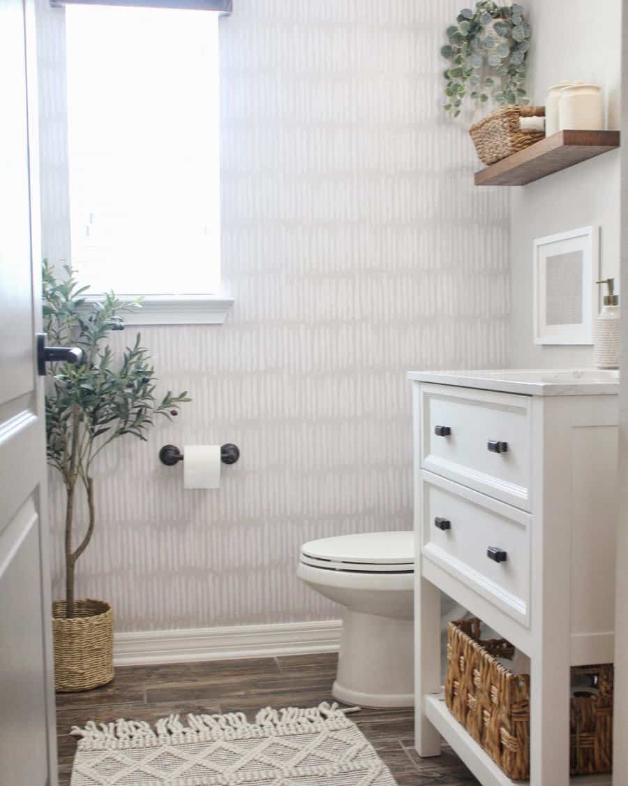 Half bathroom with wallpaper