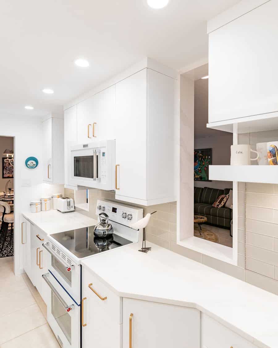 White kitchen with gold fixtures 