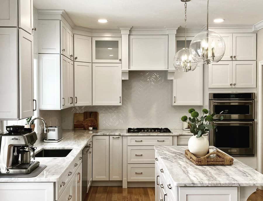 white kitchen with marble countertop