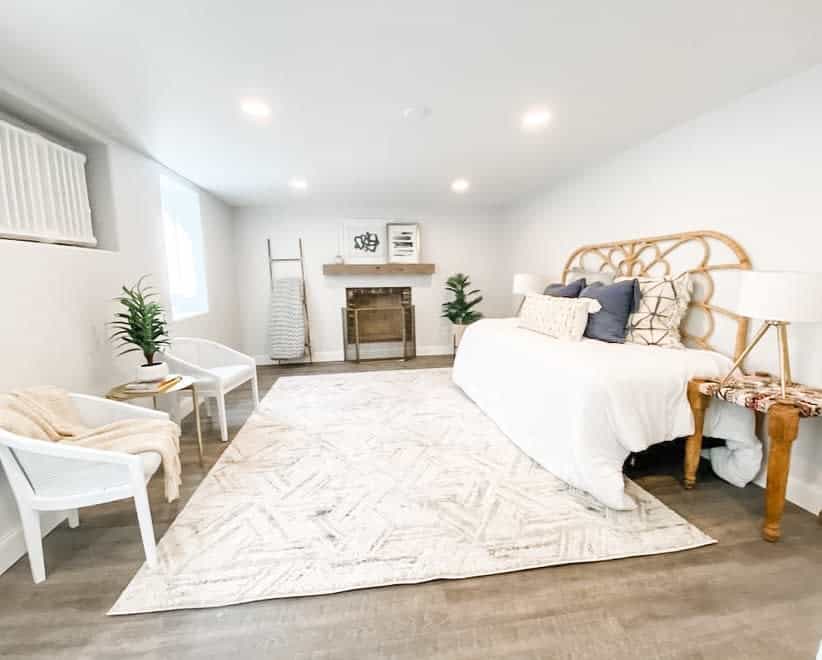 Bright bedroom with fireplace and sitting area