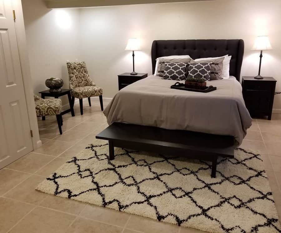 Elegant bedroom with patterned chair and rug