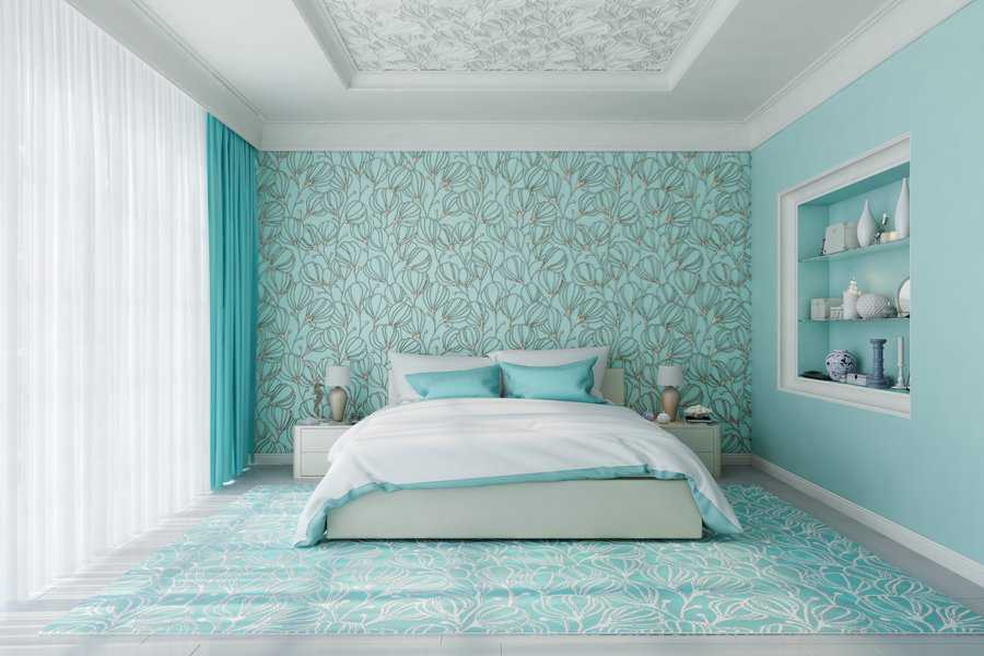 blue bedroom with printed wallpaper and flooring