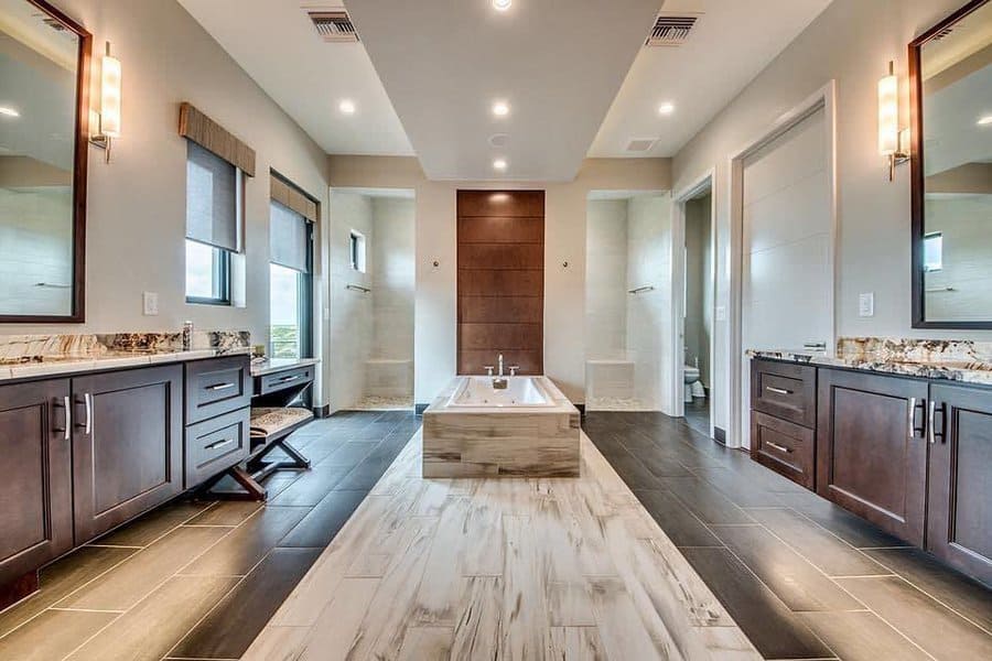 Spacious bathroom with dual vanities and wood accents