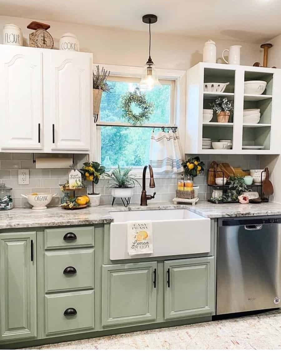 Farmhouse kitchen with pastel sage green cabinets