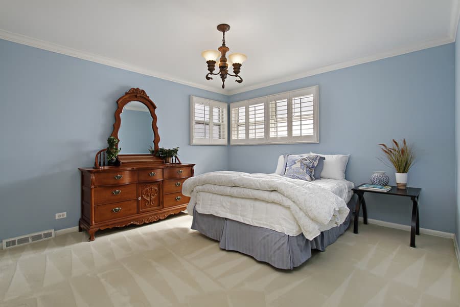 blue bedroom with vintage vanity