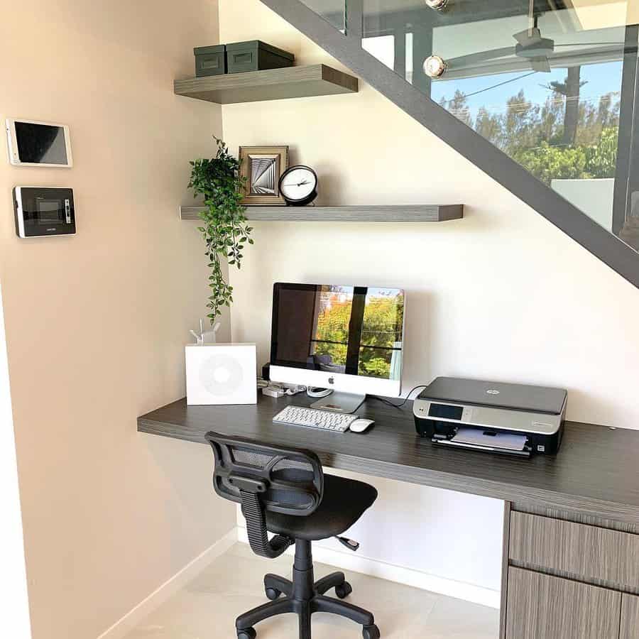 Under stairs modern office with floating shelves and greenery