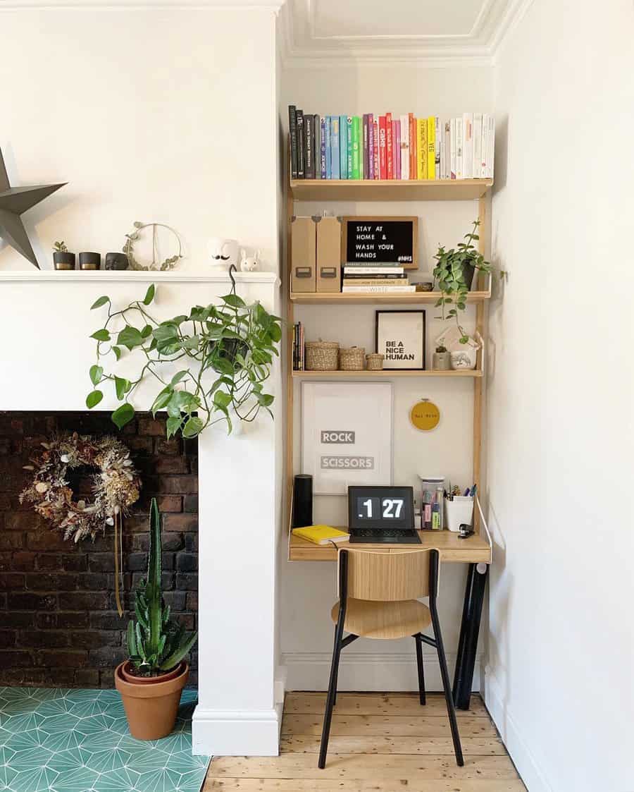 Eclectic corner office with rainbow bookshelf and greenery