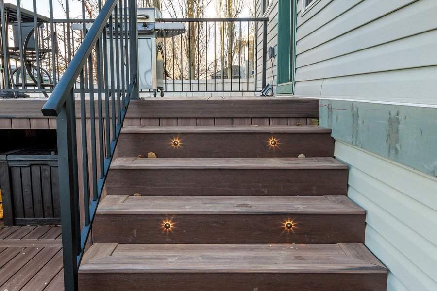 Deck stairs with lights and metal railing