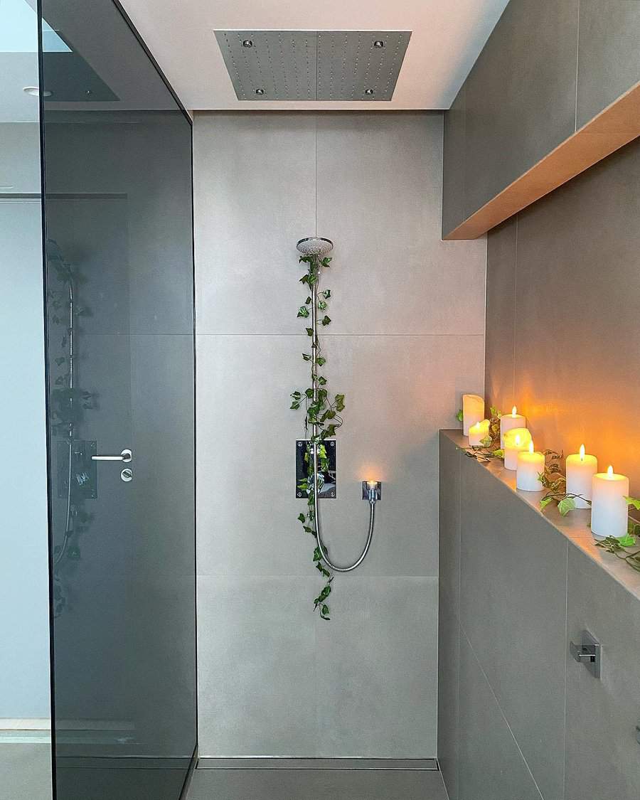 Modern bathroom with rainfall shower and candles