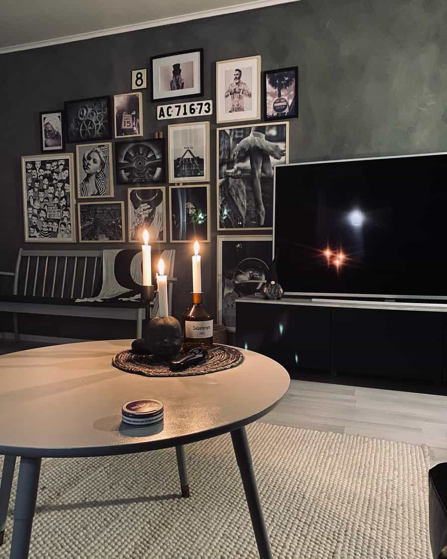 Dark themed living room with gallery wall and candles