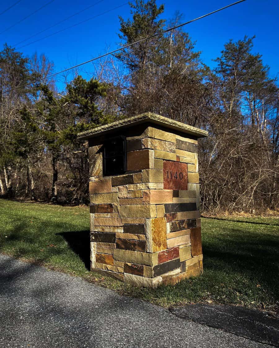 Stone mailbox on a roadside