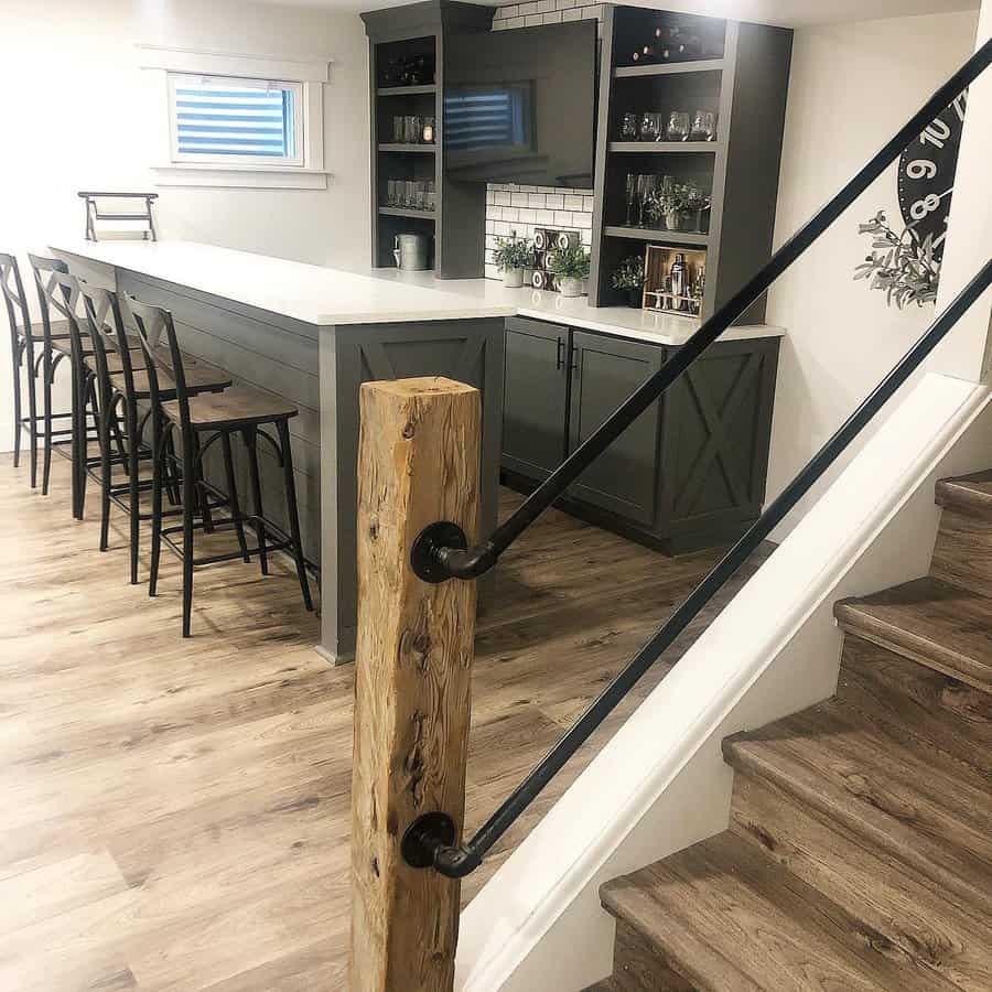 Stylish basement bar area beside the staircase