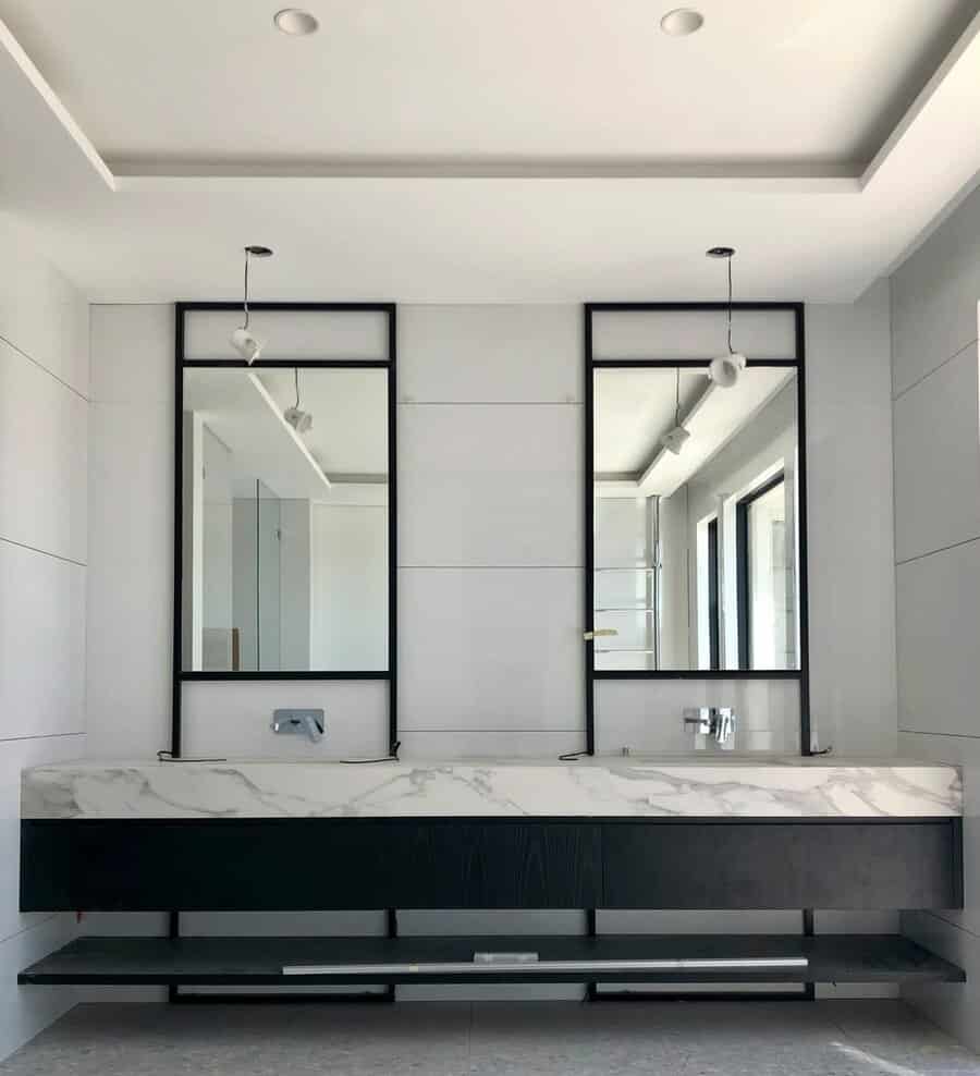 Minimalist bathroom with marble and pendant lights