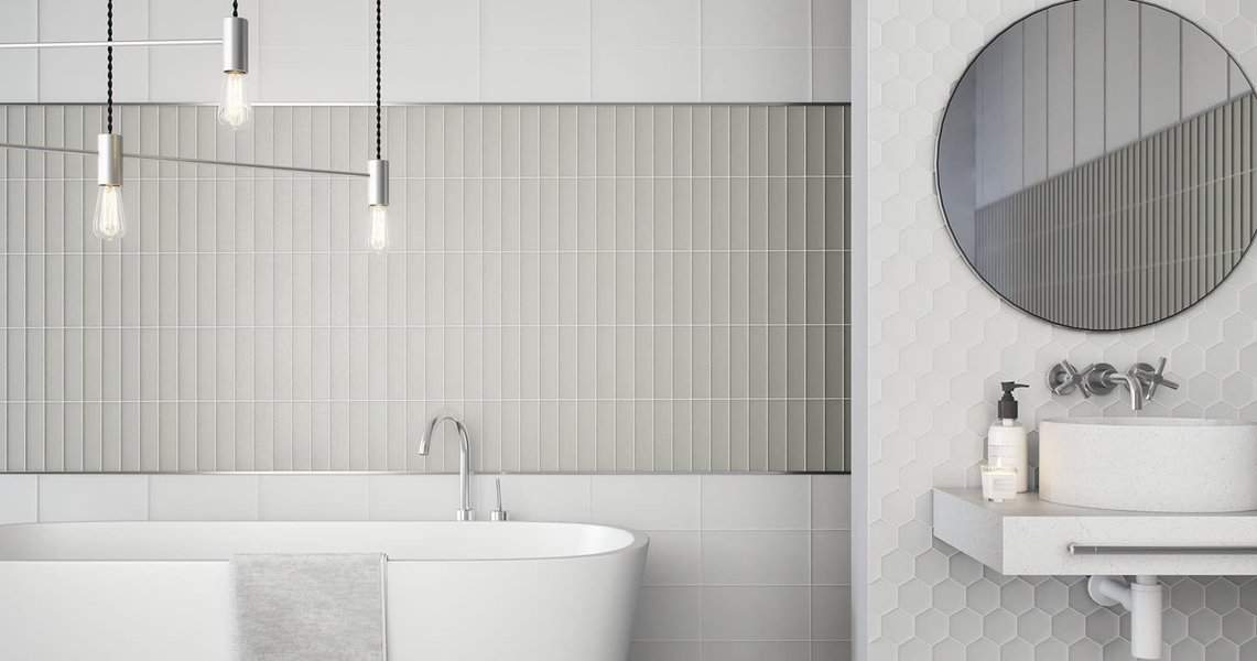 Modern bathroom with tiled wall and pendant lights