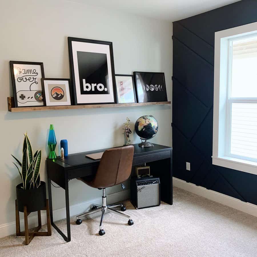 Minimalist home office with a black desk, brown chair, globe, and decor on a shelf; green plant and blue lava lamp beside the desk