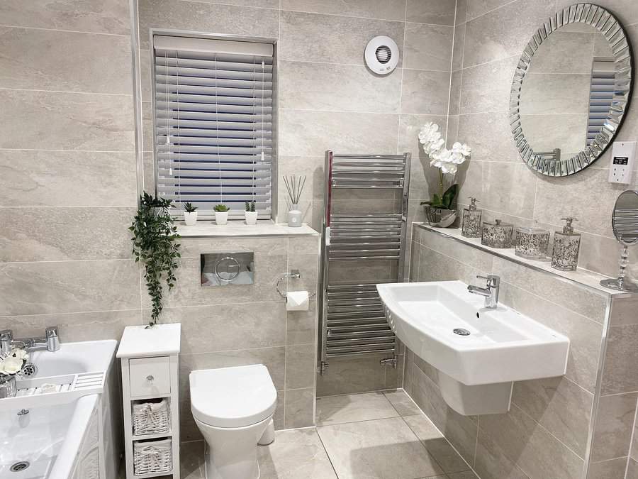 contemporary grey bathroom with silver fittings
