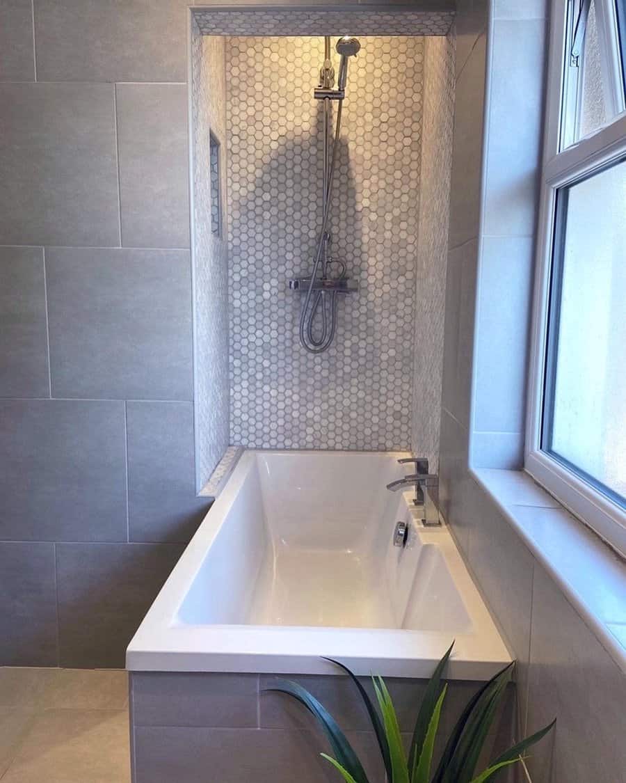 contemporary grey bathroom with decorative graphic tiles