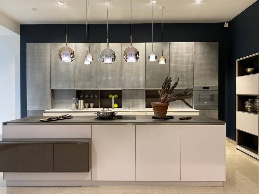 Sleek modern kitchen with metallic backsplash