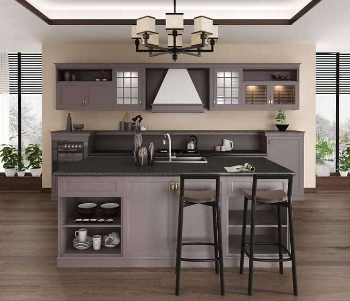 Modern kitchen with island, bar stools, cabinets, and pendant lighting