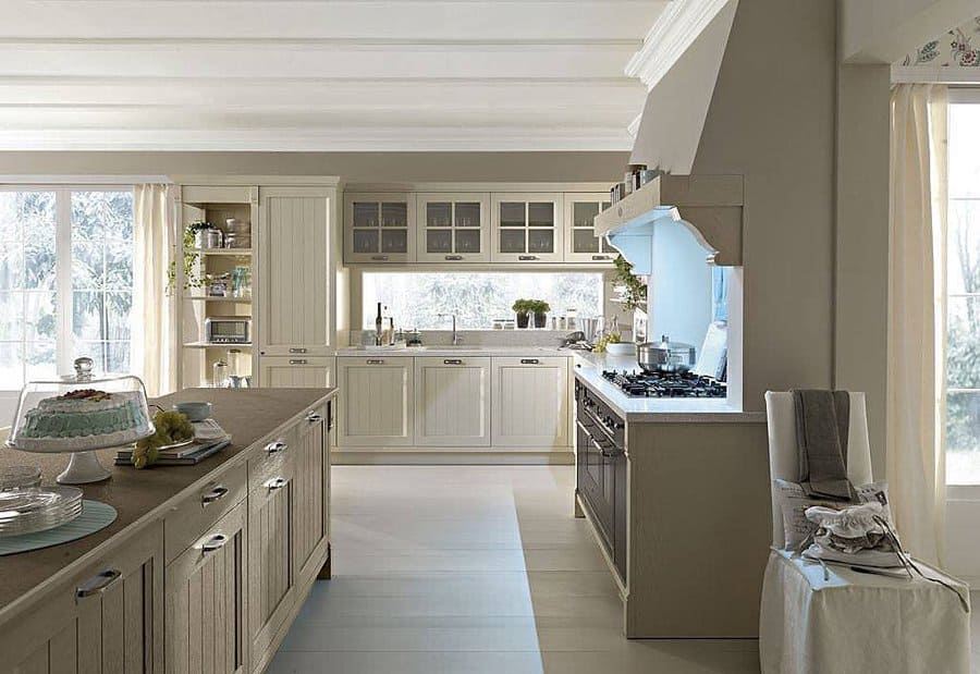 A bright, modern kitchen with beige cabinets and a large island