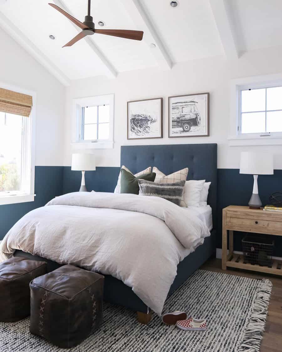 Cozy bedroom with a bed, white bedding, green headboard, two bedside tables with lamps, and wall art above in a bright, airy space